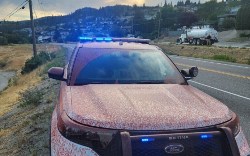 A police vehicle that was splattered with red fire retardant during the wildfire season in Peachland, B.C., in 2025.